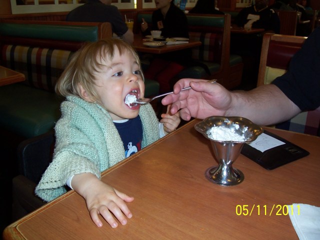 5-11-2011 Daddy feeding Aidan whipped cream at Friendly's